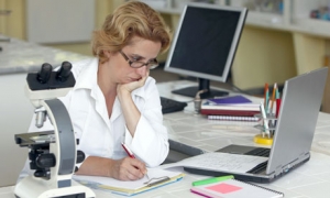 Female researcher taking notes